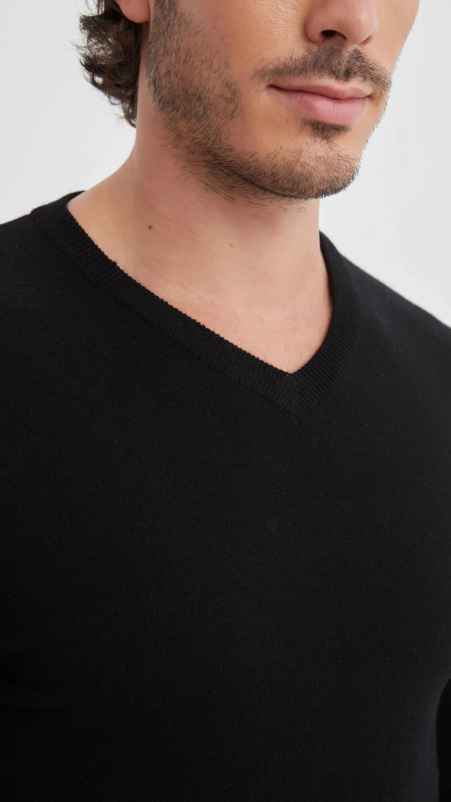 Black V-neck sweater with elbow pads