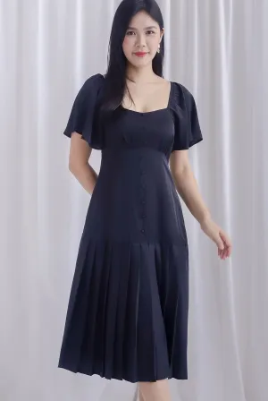 Rachelle Pleated Drop Waist Midi Dress In Black