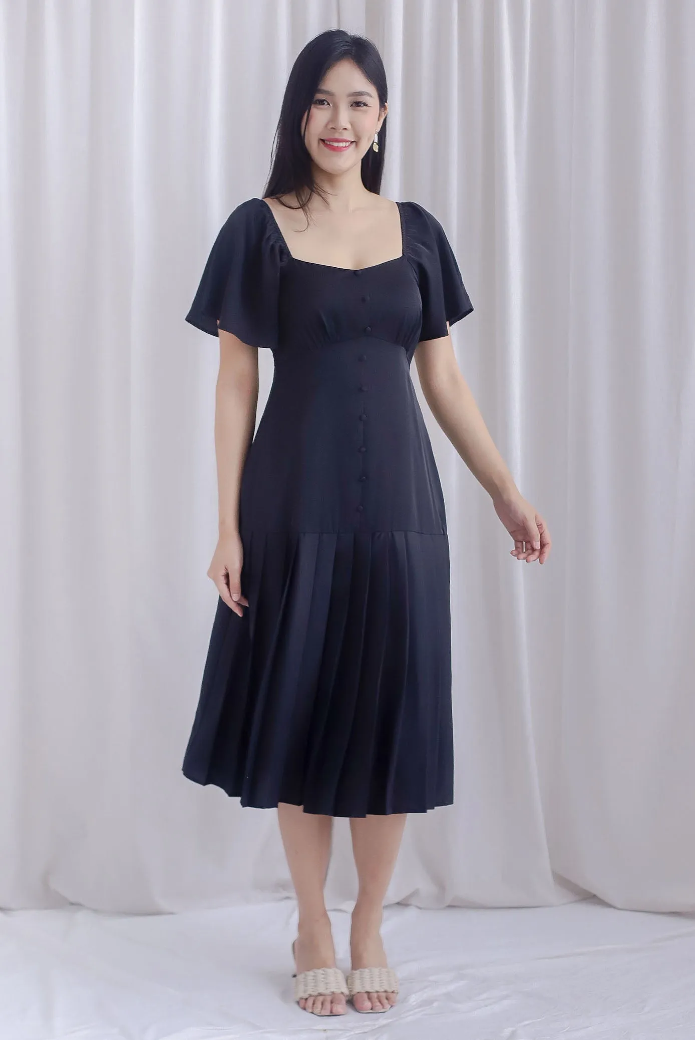 Rachelle Pleated Drop Waist Midi Dress In Black